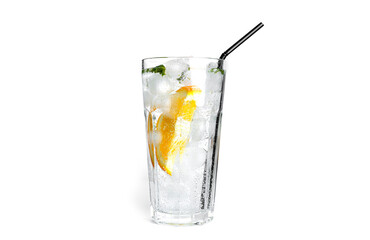 Orange lemonade with mint and ice in a clear glass isolated on a white background.