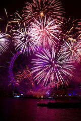 festive New Year  fireworks by the River Thames in London.