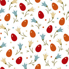 Seamless Easter pattern. Bright Easter eggs and snowdrops on a white background in random order.