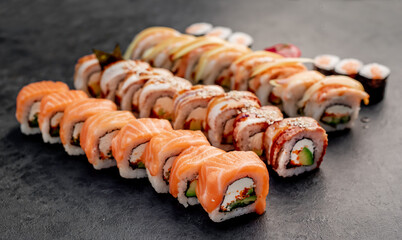 Assorted sushi. set of sushi rolls and nigiri on a stone background