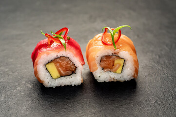 one sushi roll on a stone background