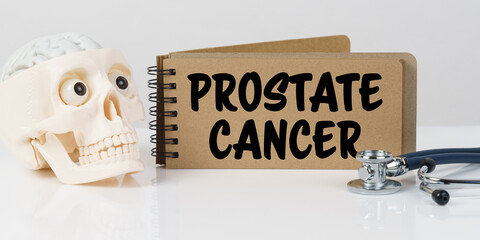 On the table lies a skull, a stethoscope and a notebook with the inscription - PROSTATE CANCER