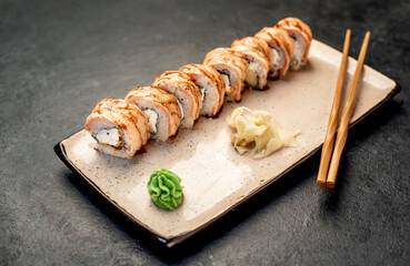 Japanese sushi rolls on a stone background