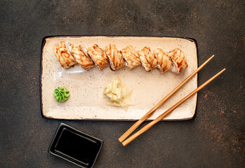 Japanese sushi rolls on a stone background