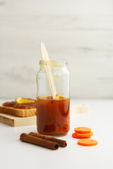 Carrot orange jam in a glass jar