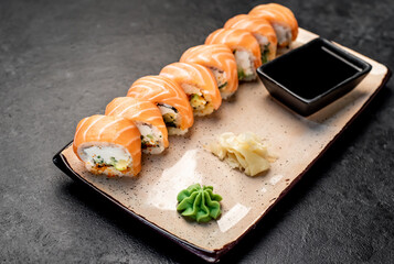 Japanese sushi rolls on a stone background