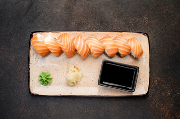 Japanese sushi rolls on a stone background