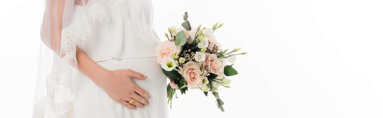 Fototapeta na wymiar cropped view of pregnant bride holding wedding bouquet isolated on white, banner
