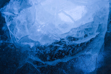 Blue cracked surface of the ice, background, texture
