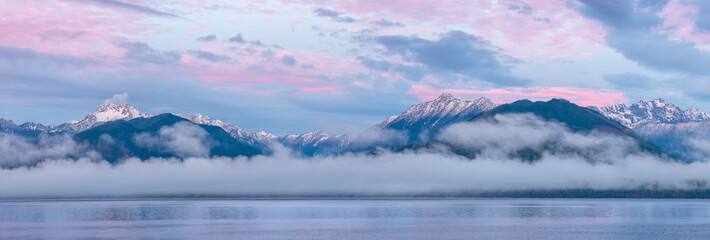USA, Washington State, Seabeck. Composite of Hood Canal and Olympic Mountains at sunrise.