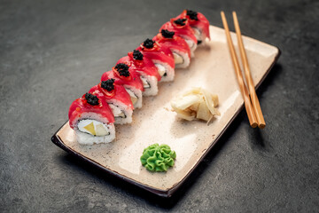 Japanese sushi rolls on a stone background