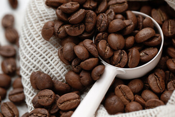 Rich brown coffee beans macro with  spoon