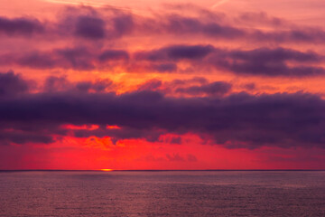 Fototapeta premium Amazing red sunrise or sunset over the sea. Nature background
