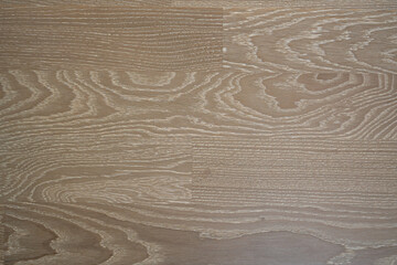 The flooring is made of natural oak with a gray tint and a white patina. Wooden parquet. Creative vintage background.