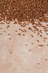Grains of raw buckwheat as a abstract background texture.
