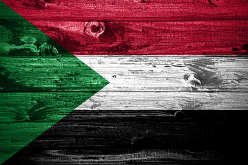 Sudan flag on wooden planks background