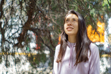 portrait of a happy beautiful woman in the park