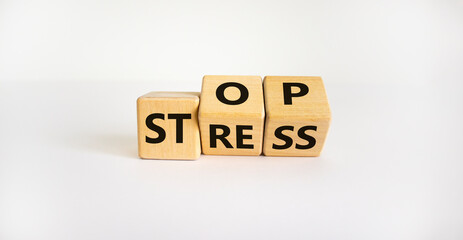 Stop stress and be health symbol. Turned cubes and changed words 'stress' to 'stop'. Beautiful white background. Psychological, business and stop stress concept. Copy space.