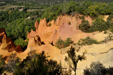 Red and white rocks in the south of France at the site of a former quarry - Colorado de Rustrel, France