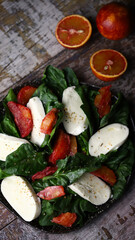 Healthy salad with spinach, mozzarella and red orange. Diet food. Fitness food.