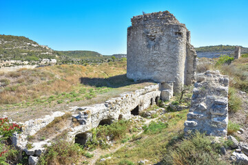 ruins of a fortress on a hill, an ancient building - Powered by Adobe