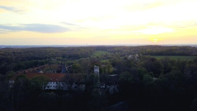 4k shooting from the air at sunset, Cappenberg Castle in the west German district of Unna