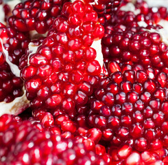 red and ripe pomegranate with juicy grains