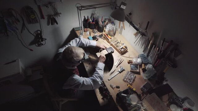 Senior man jeweller working at his workshop
