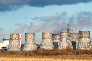 Cooling towers of Nuclear power plant emissions of steam in the air atmosphere. Industrial zone...