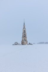 Bell tower in the middle of a frozen lake