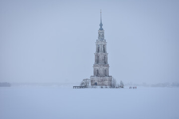 Bell tower in the middle of a frozen lake