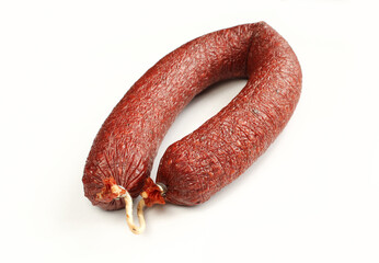 Smoked beef sausage isolated on white background. Delicious traditional meat