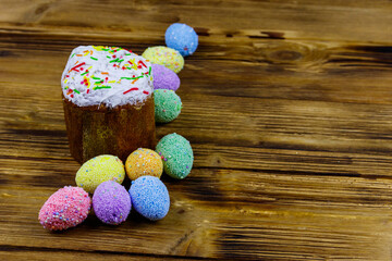 Easter cake and easter eggs on a wooden table