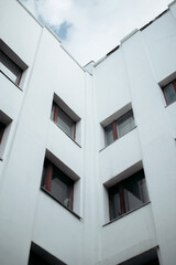 Fototapeta na wymiar corner of the white facade of a Soviet constructivist building