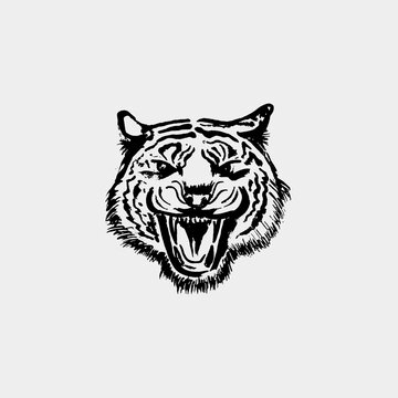 Angry Tiger Face. Black paint, ink brush strokes, brushes, lines, grunge. Freehand drawing. Vector illustration. Isolated on white background.