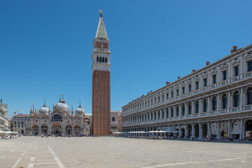 st mark's basilica of venice with tourists on a clear and sunny day
