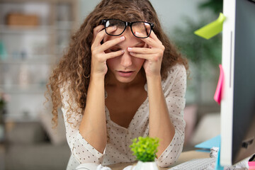 female office worker is tired of work and exhausted