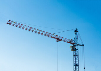 Industrial landscape, cranes, pipes with smoke. Air pollution from smokestacks, ecological problems.