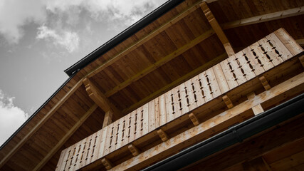Frog view of a wooden balcony,typical for austrian moutain huts.