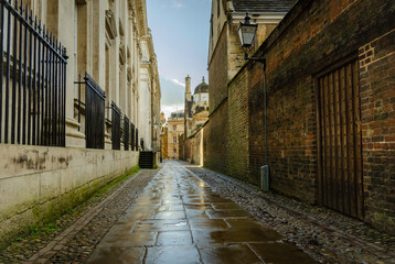 Typical mysterious old English dark street after rain in Cambridge. 