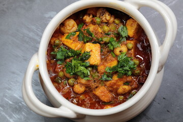 A spicy Makhana Paneer curry in a bowl.