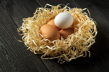 Eggs and shavings in the nest. Idea for preparing for the celebration of Easter
