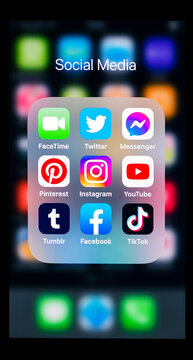 2020: Apple iPhone black smartphone screen showing the Social Media icons bundle, closeup