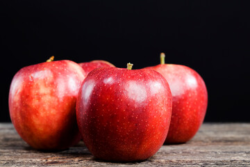 red apples on a wooden board