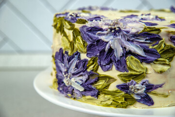 biscuit cream cake with purple flowers