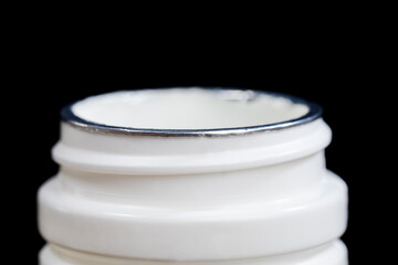 an open white plastic jar