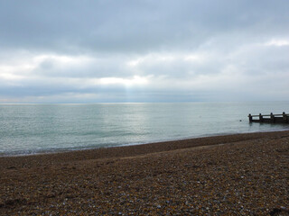 Pebble beach on a cloudy day with little sunshine
