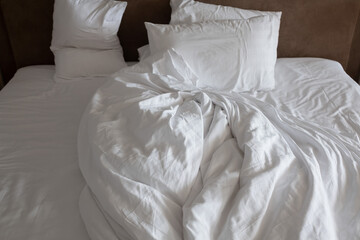 Fototapeta na wymiar white bed background, after sleep, dirty bed
