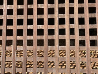 Brown wooden lattice fence, square patterned background
from wooden fence