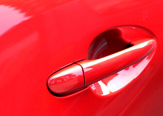 Door in a sports red car.